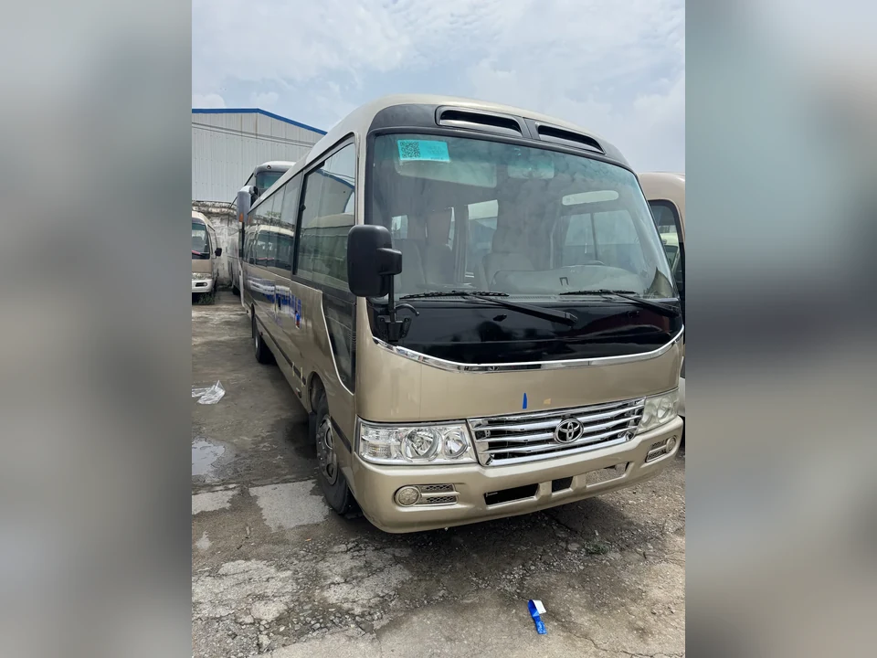 Coaster-type minibus, front three-quarter view; brand unconfirmed